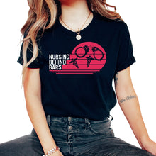 Load image into Gallery viewer, Nurse Shirt, Nursing Behind Bars Tee, RN Gift Ideas, Jail Registered - Unisex T-Shirt - Black

